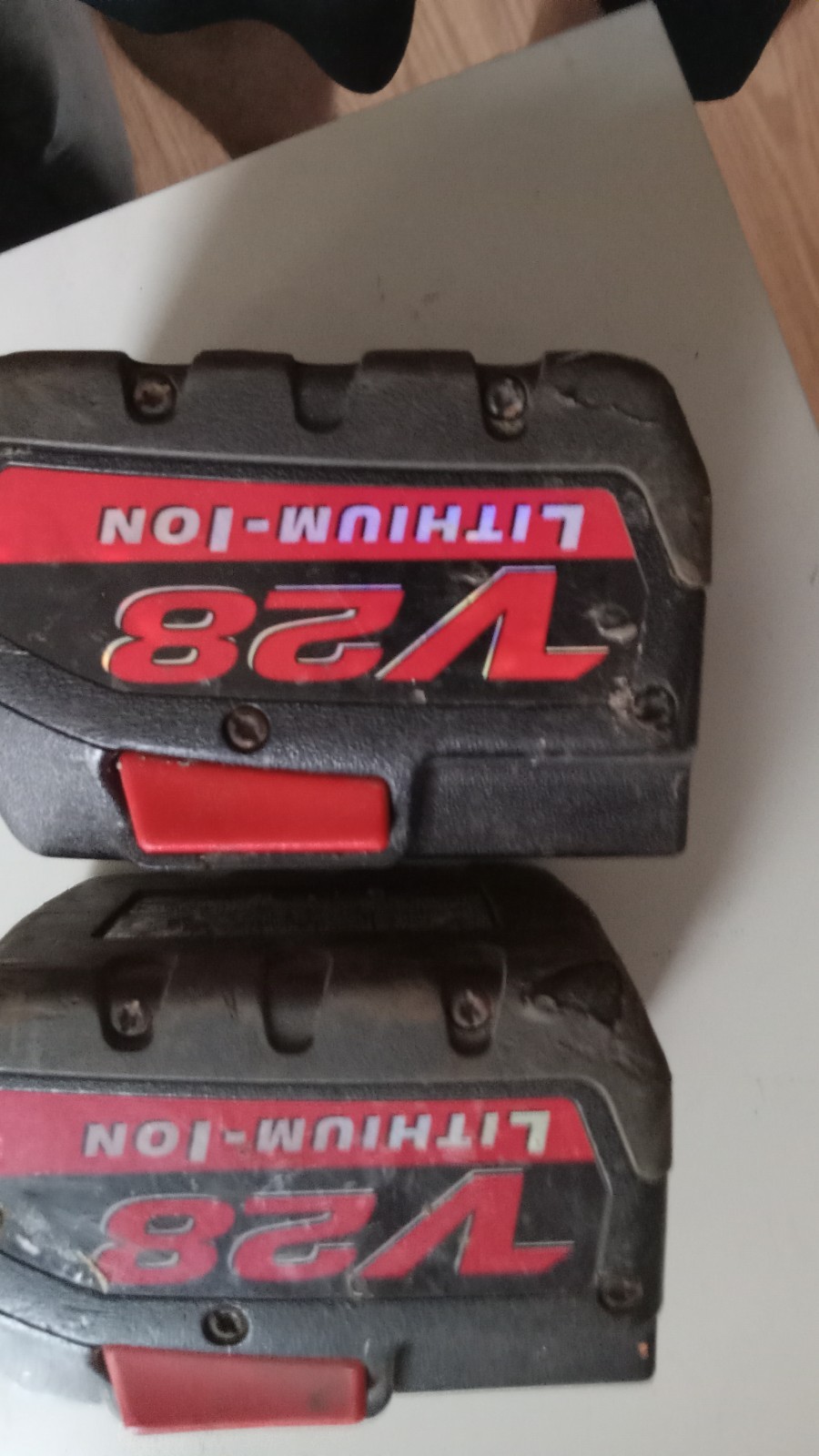 2 milwaukee 28  volt batteries for repairs for repairs