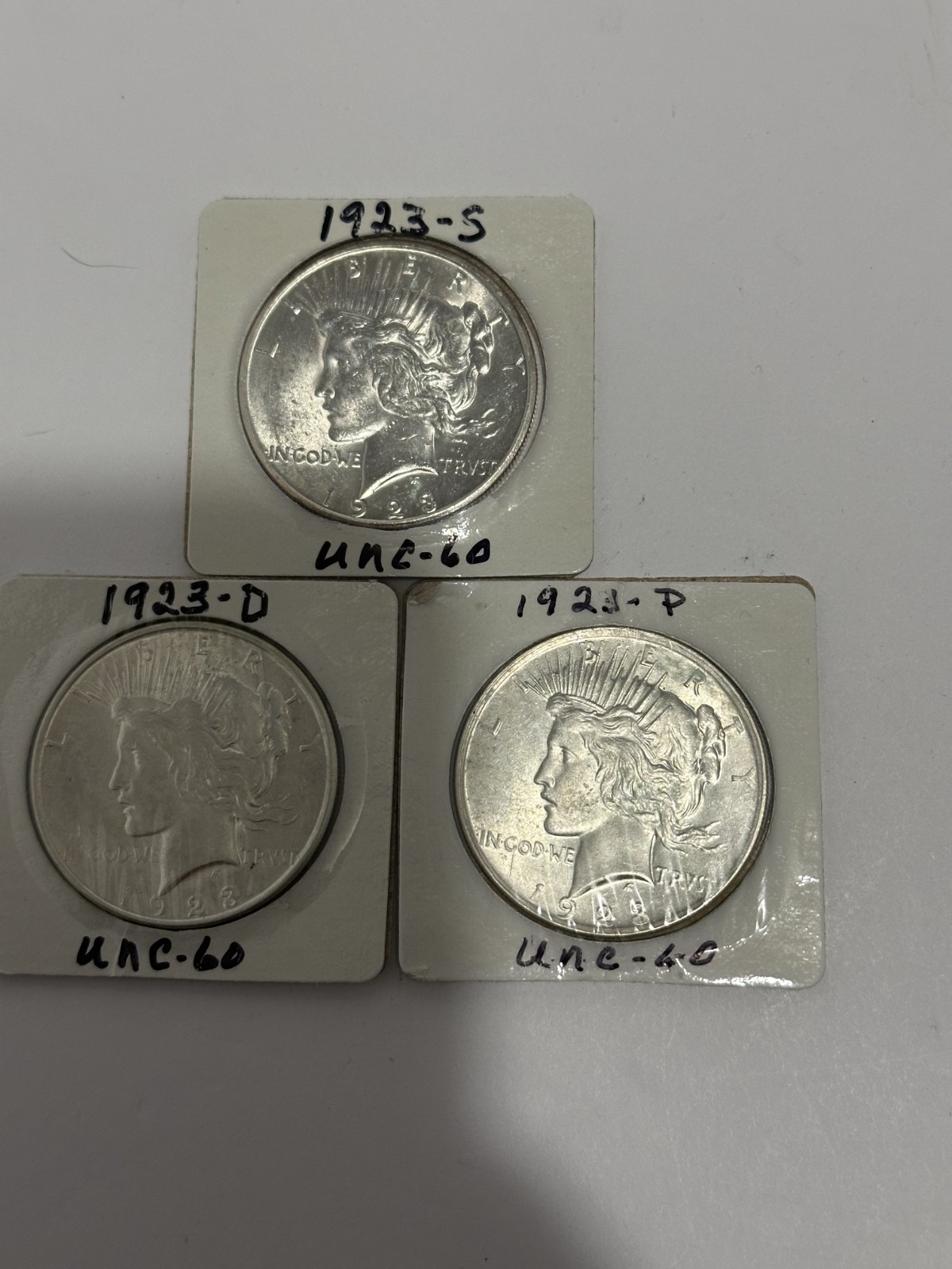 Peace Dollar 1923 Set (P, D, and S mints) in good condition and in sealed casing