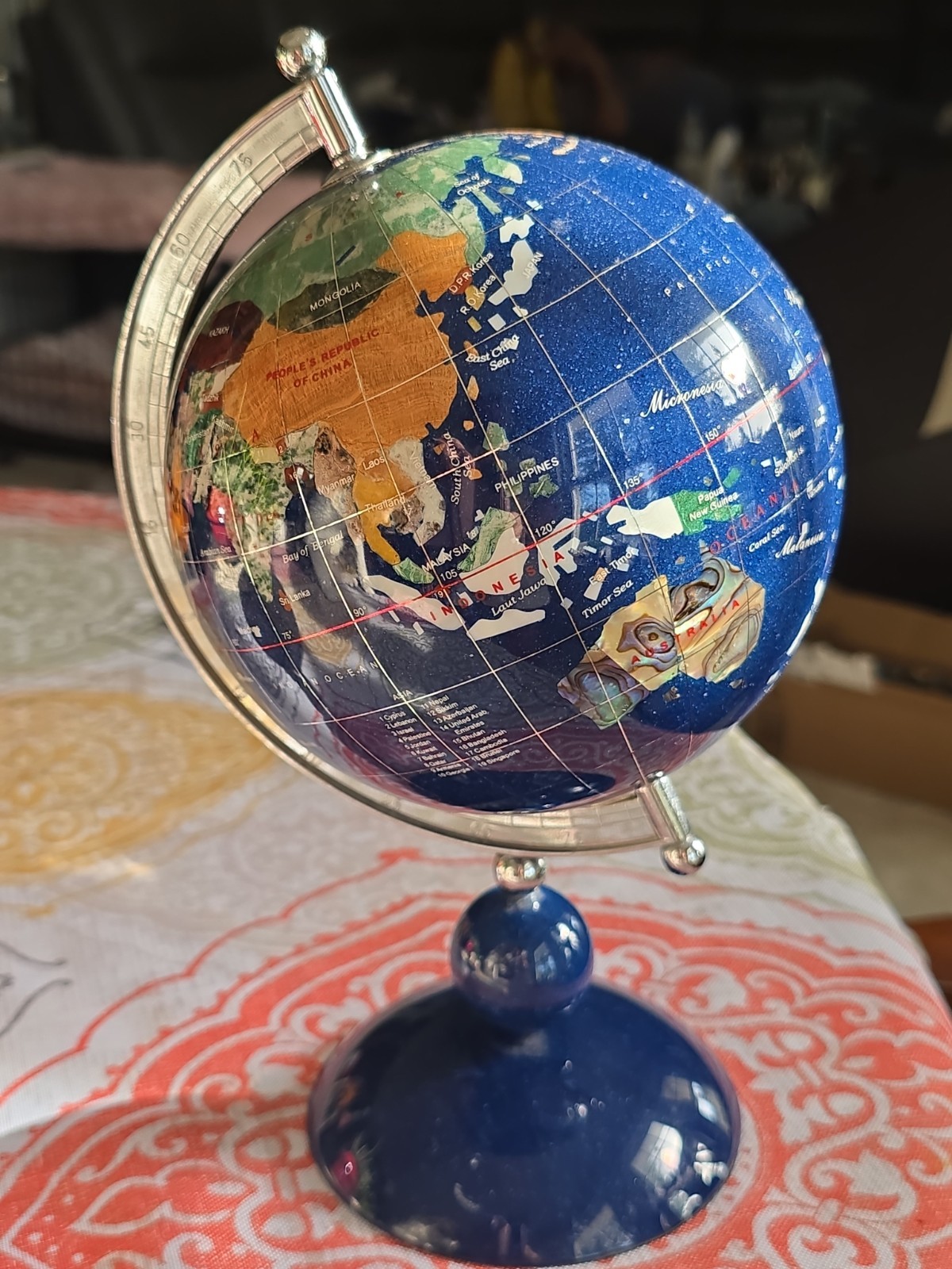 Vintage lapis lazuli ground with mother of pearl and semiprecious stones Globe