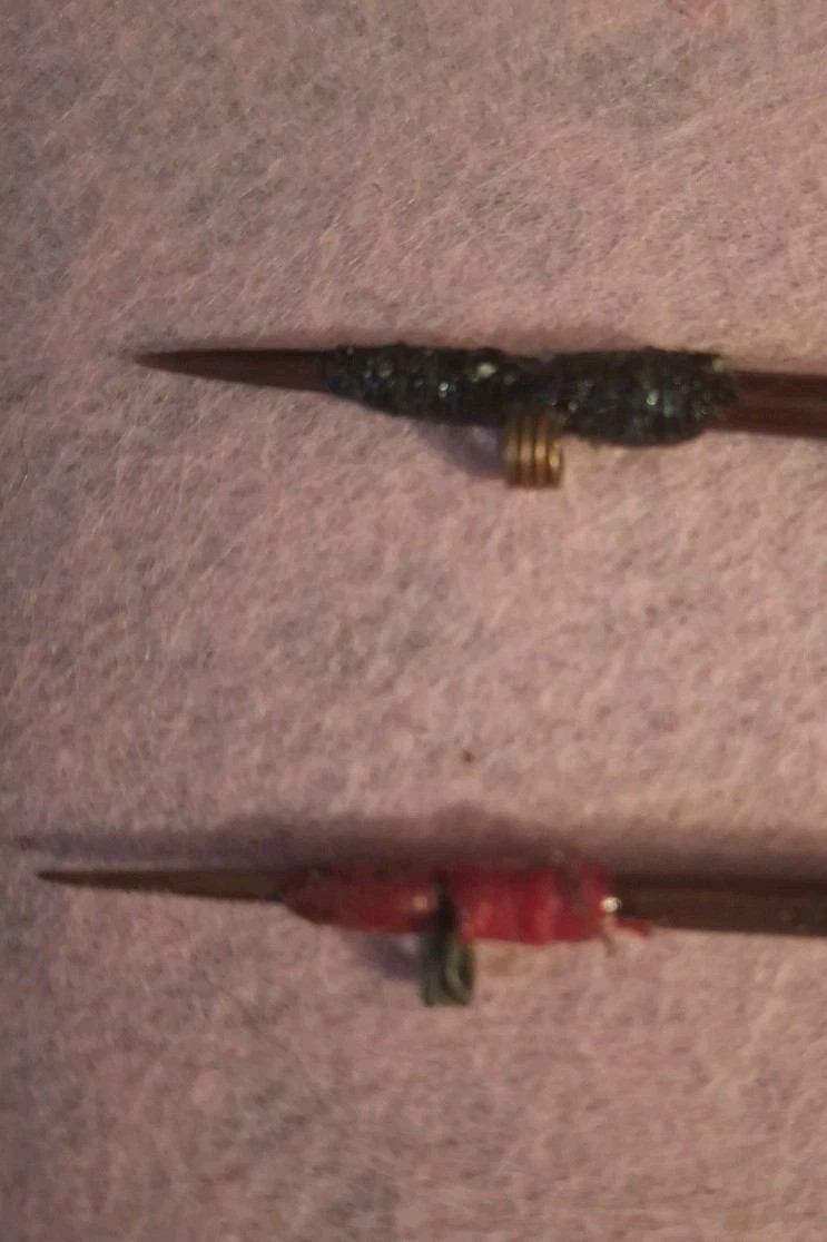 TWO HANDCRAFTED PORCUPINE QUILL FLOATS