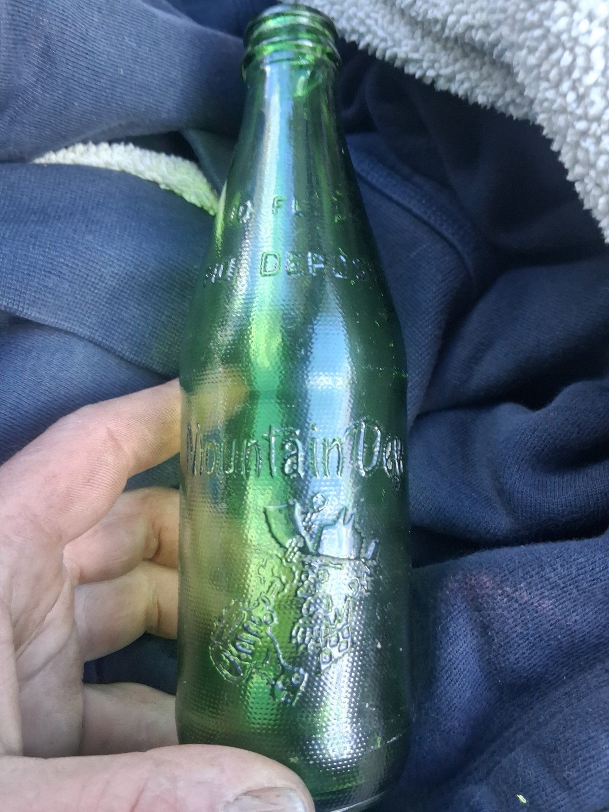 1960's green Mountain Dew 10 fluid ounce glass bottle It'll tickle your innards