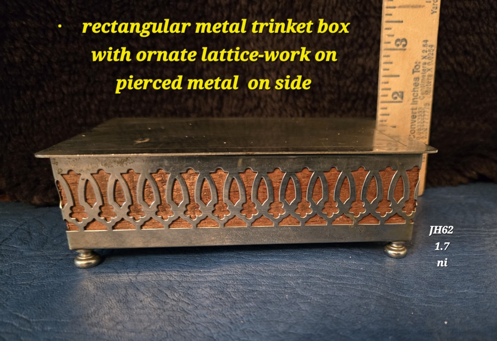 rectangular metal trinket box with ornate lattice work on pierced metal  on side