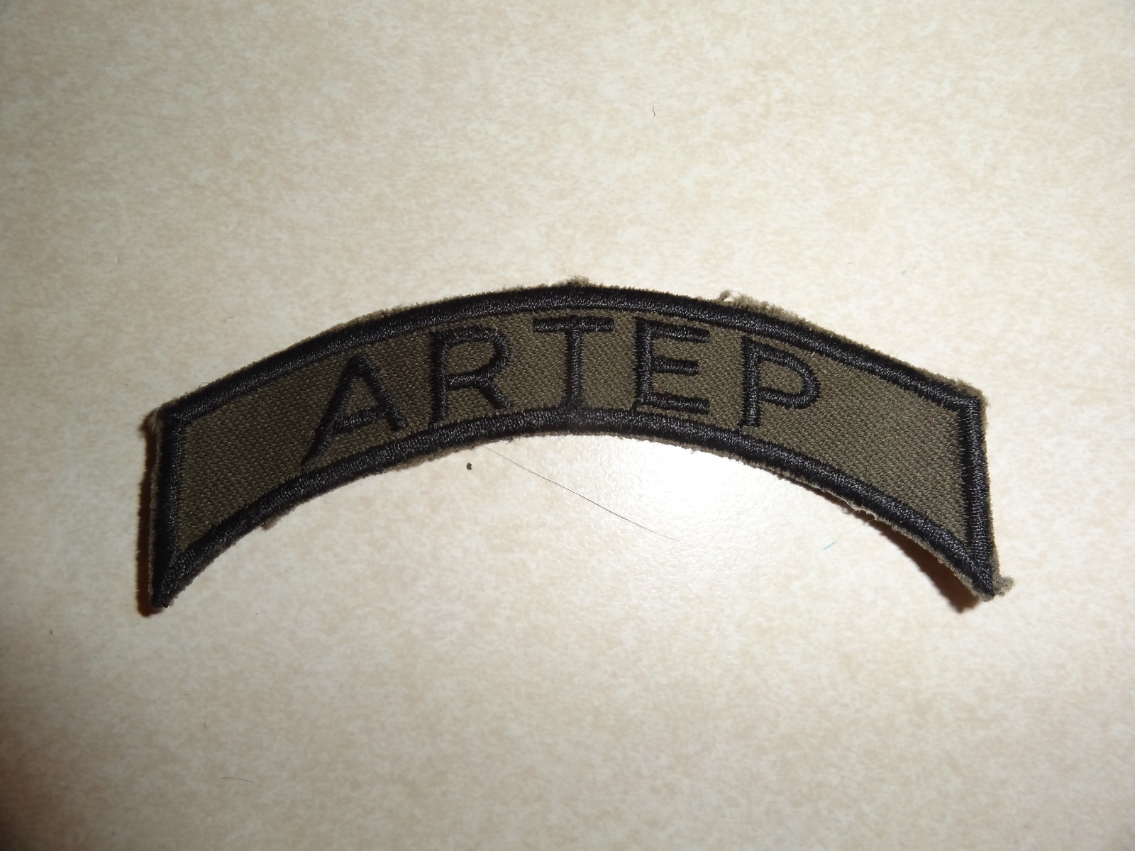 US MILITARY PATCH INSIGNIA TAB ARTEP GREEN AND BLACK ABOUT 4 INCHES GERMAN MADE