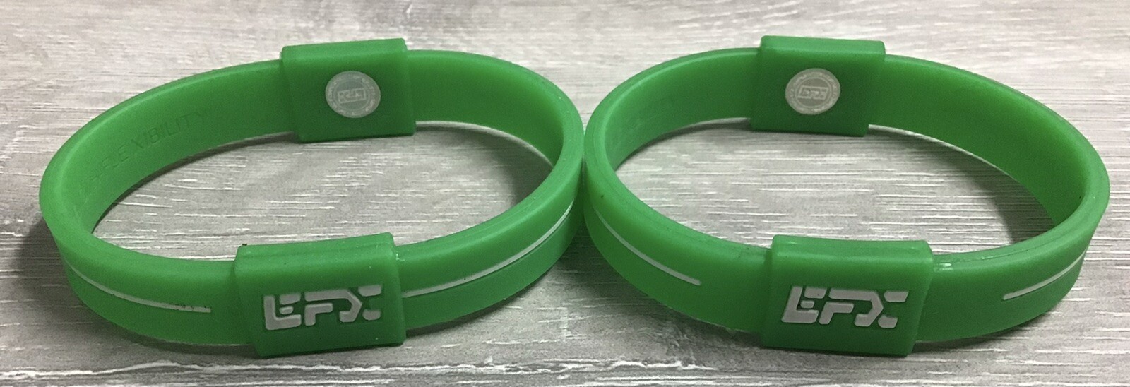(LOT OF 2) EFX Hologram Silicon Balance Wristband Green/White - M - NEW - NO BOX