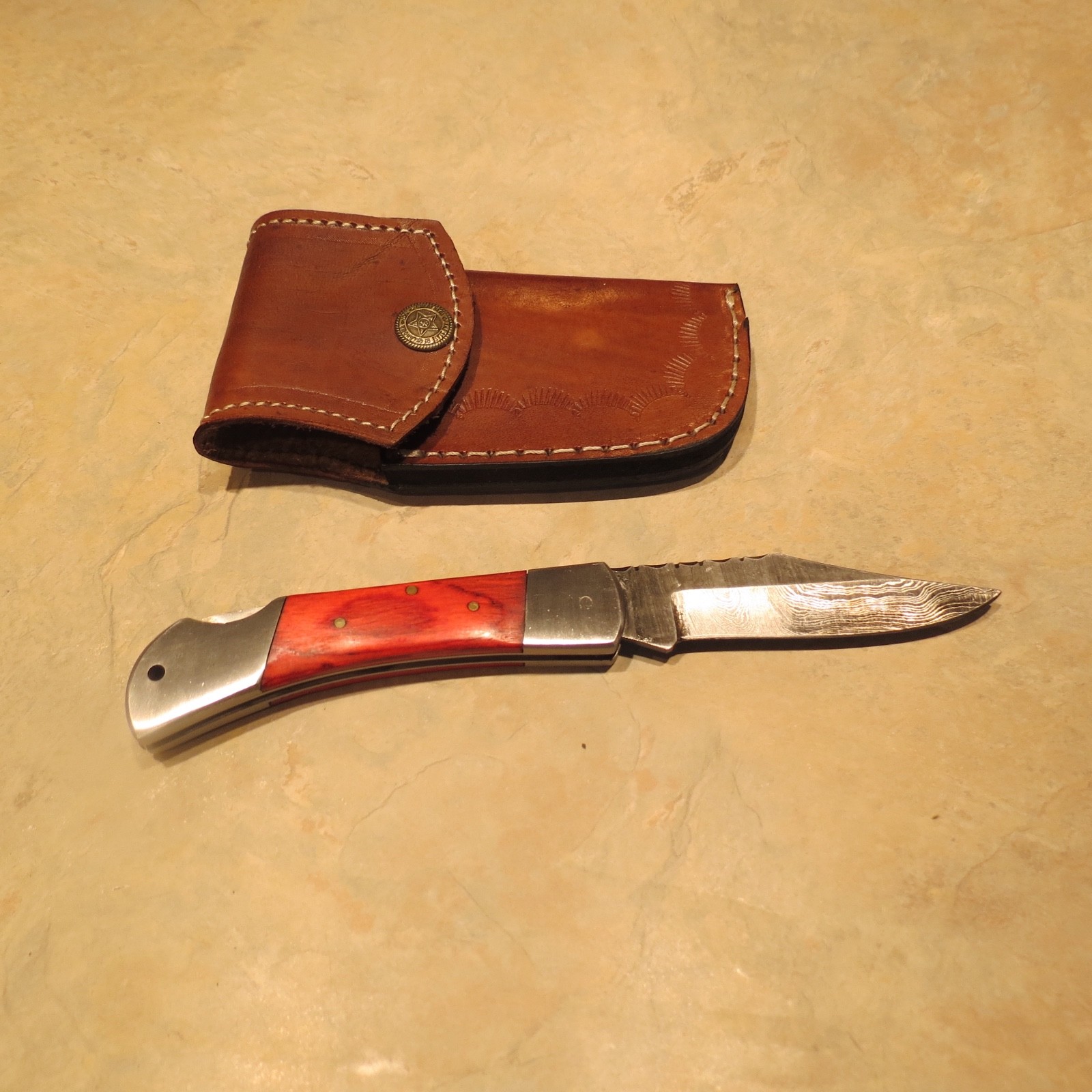 Damascus folding blade knife red laminate handle & leather sheath hand made