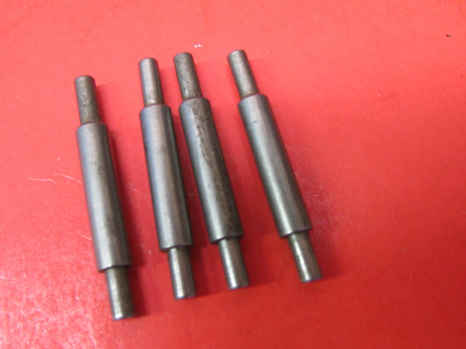4 SMALL TURNED METAL  MUFFLERS - 1 3/8"  TALL  - LOOK AT PICTURES , TRACTOR PART