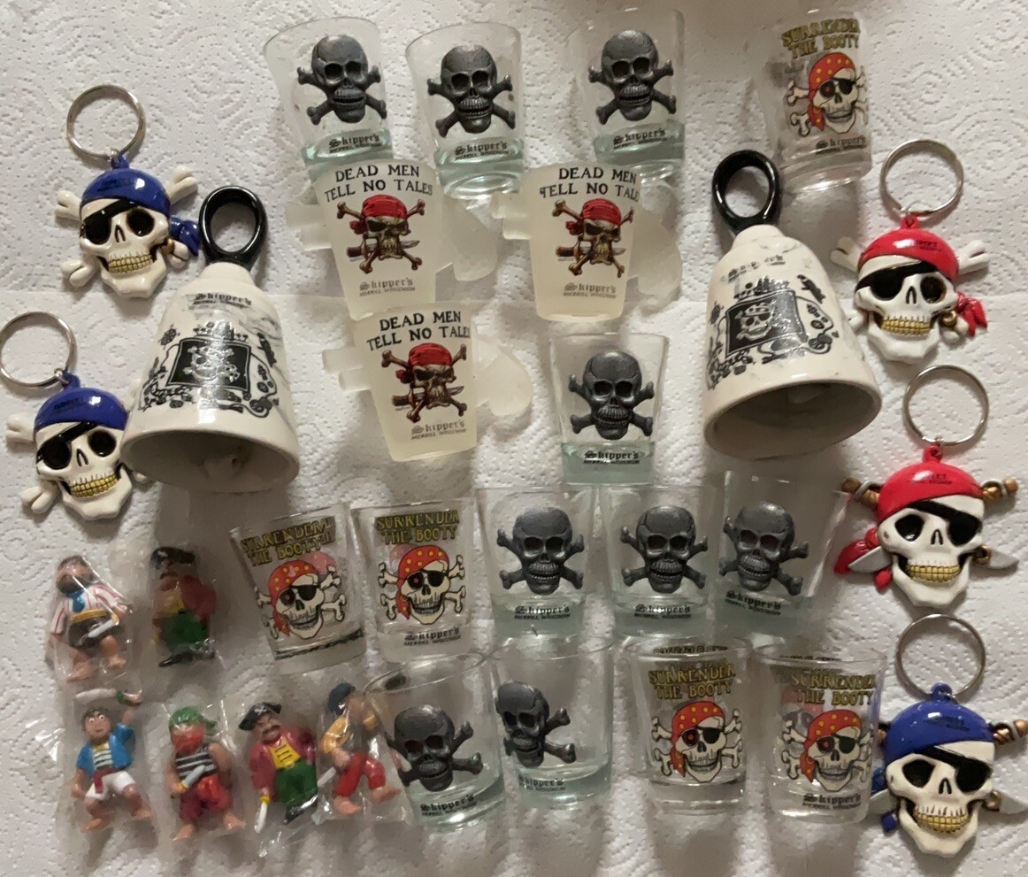PIRATES OF THE CARRIBEAN COLLECTION SKULL SHOT GLASSES,BELLS,KEY CHAIN,DOLL,NOS