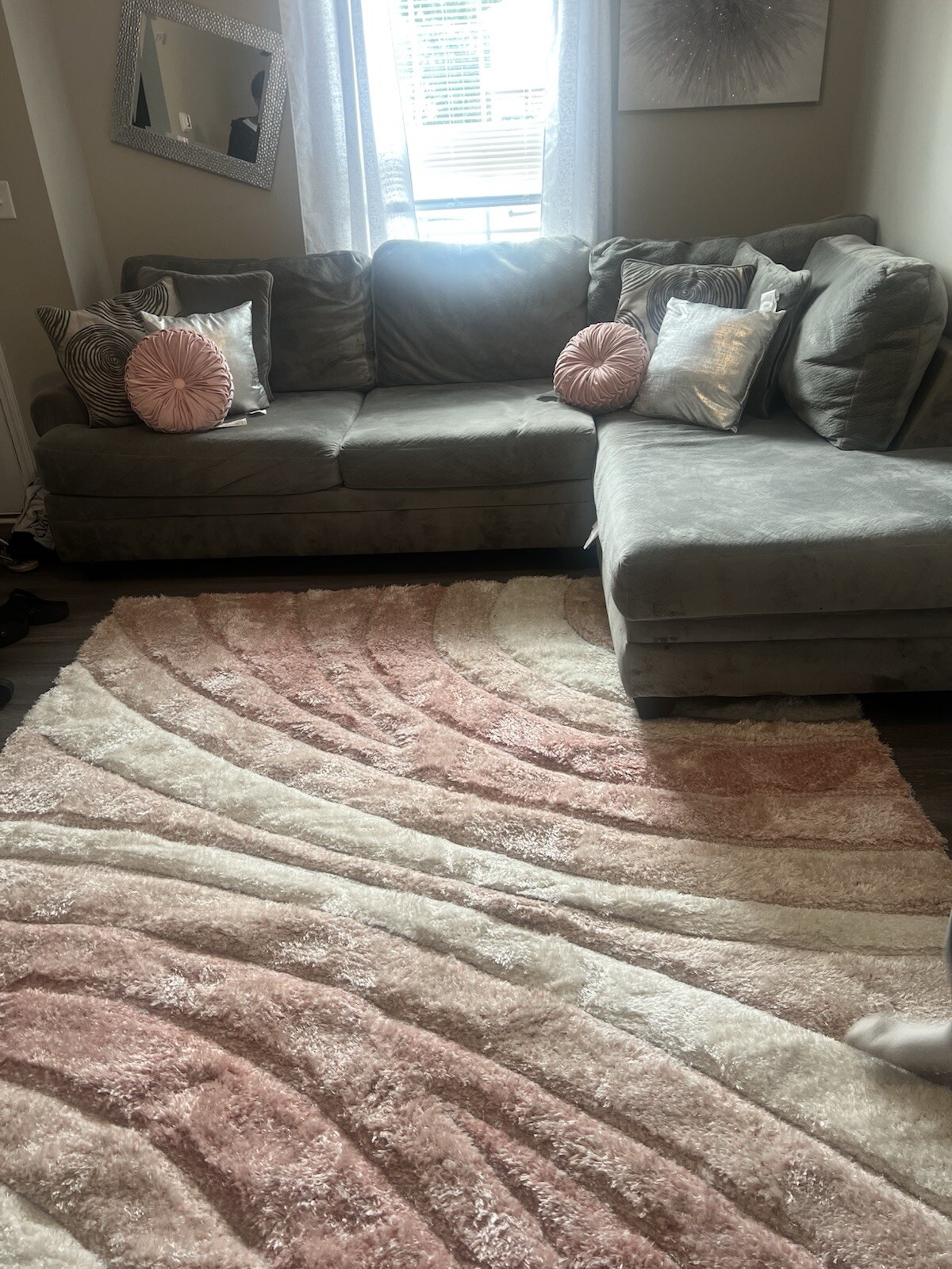 Grey Couch  And Photos On Wall