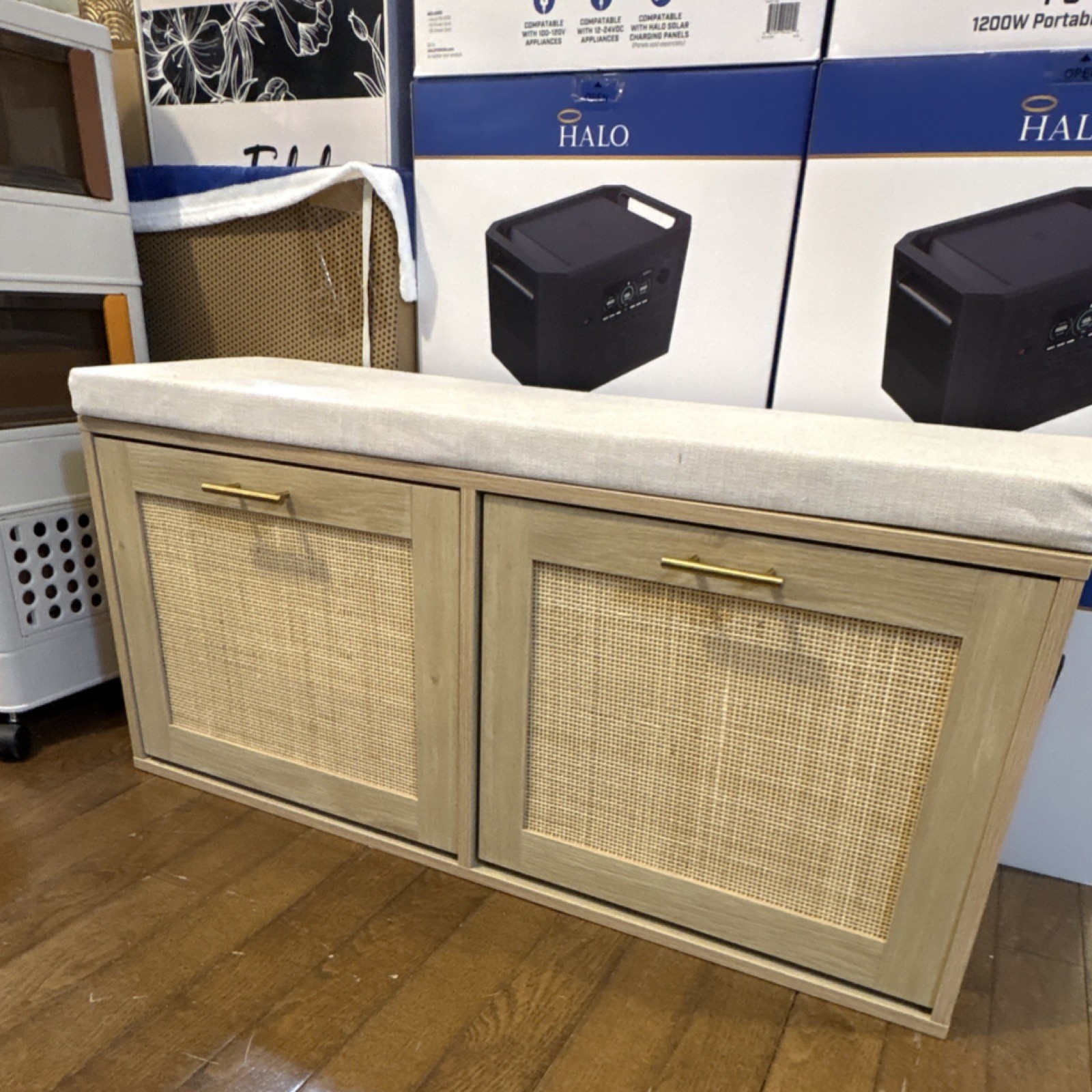 Light Wood Storage Bench with Beige Canvas Cushion and Cabinet Doors