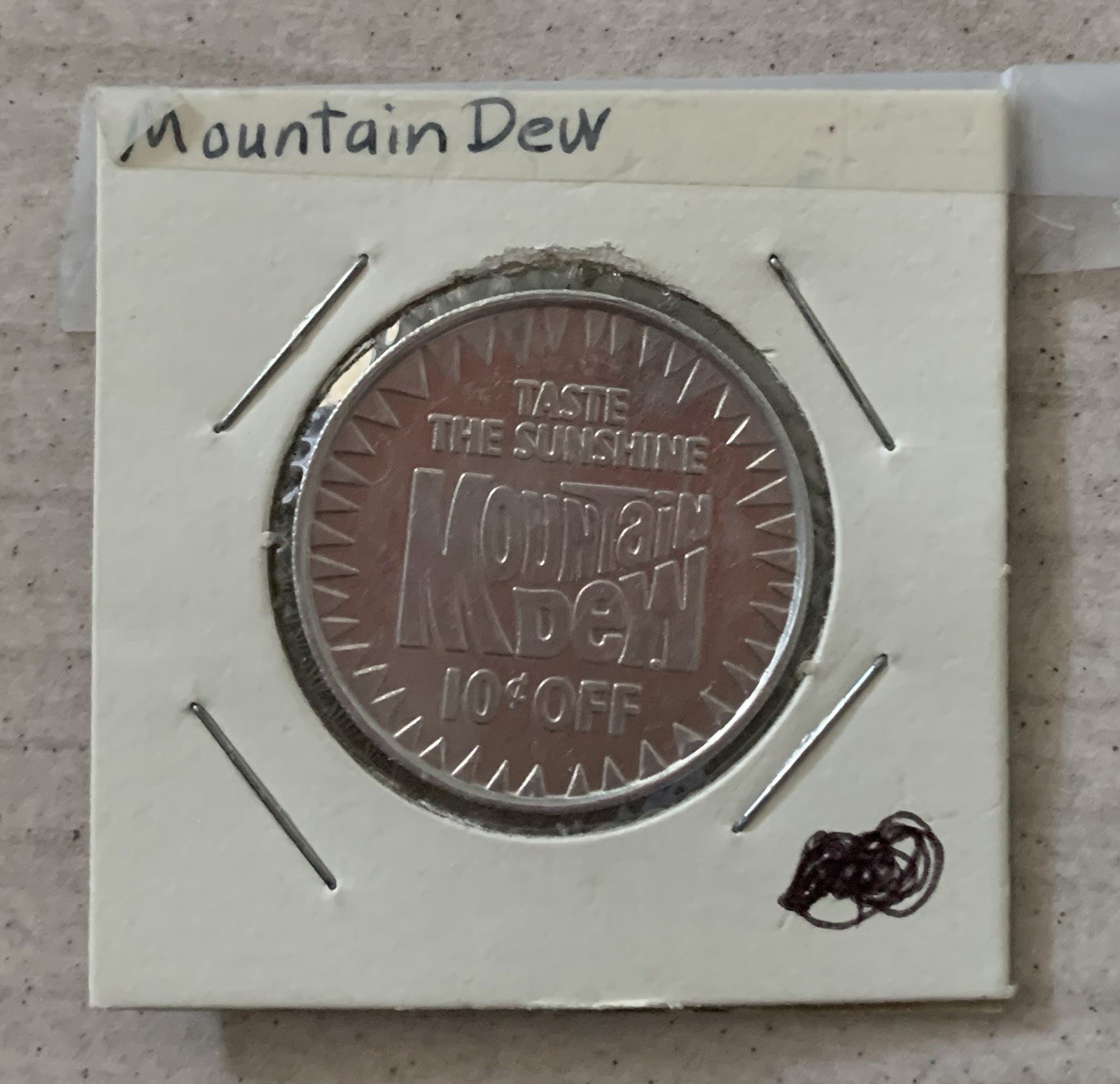 1980 Mountain Dew Token “Taste The Sunshine” Promo 10¢ Off Soda Coin Vintage