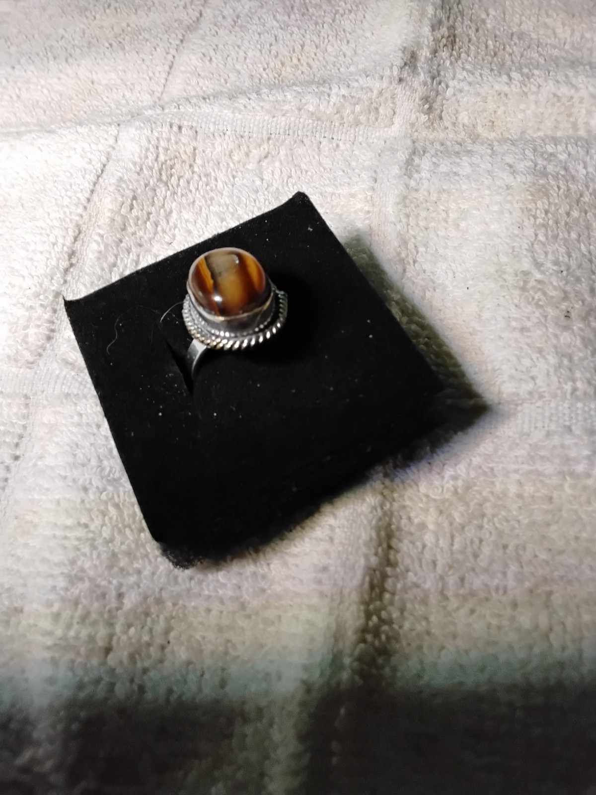 Tiger's Eye Oval Ring Bezel Set In Rhodium Plated Setting. Size 7