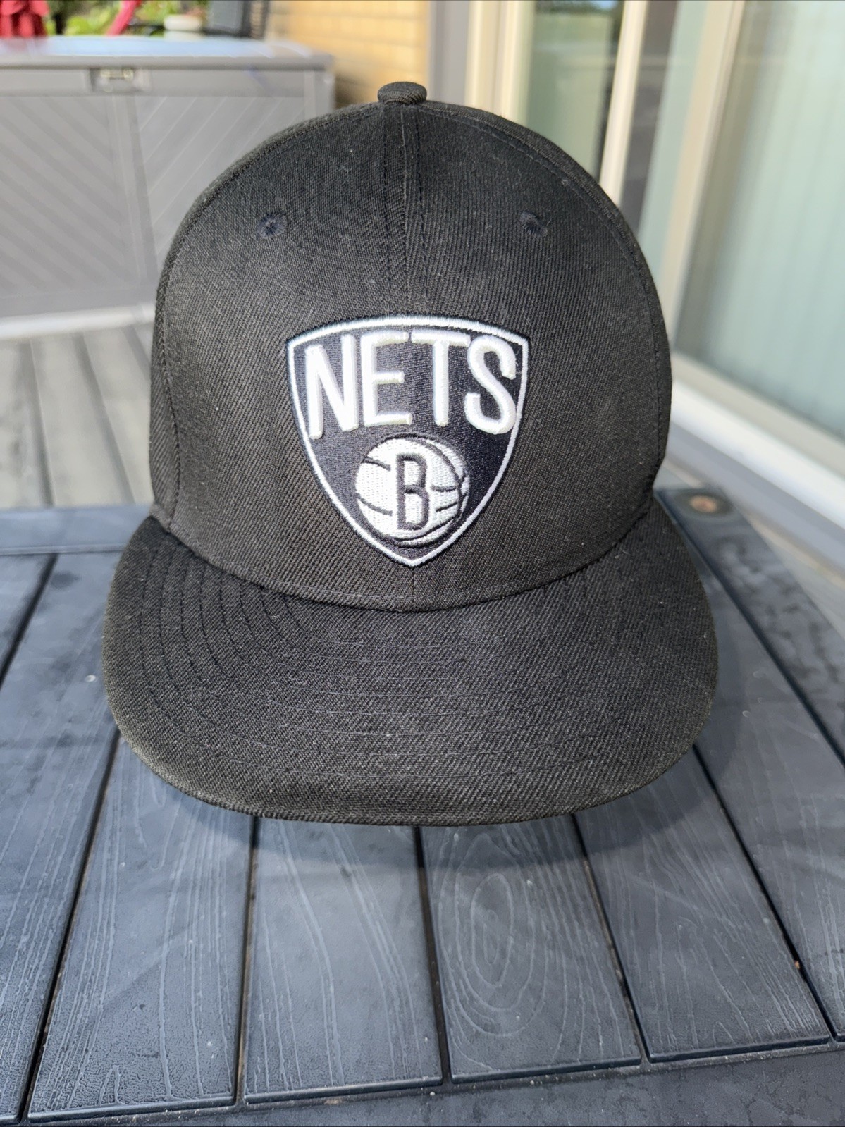 NETS B inside of Basketball on Shield in White on Black Hat Cap Brooklyn NetsNBA