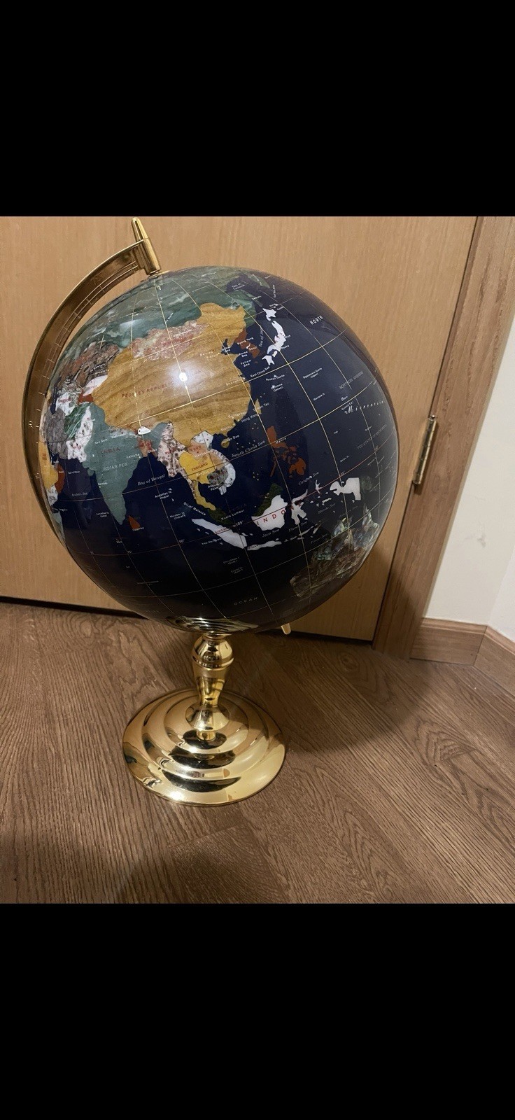 Blue lapis gemstone world map globe