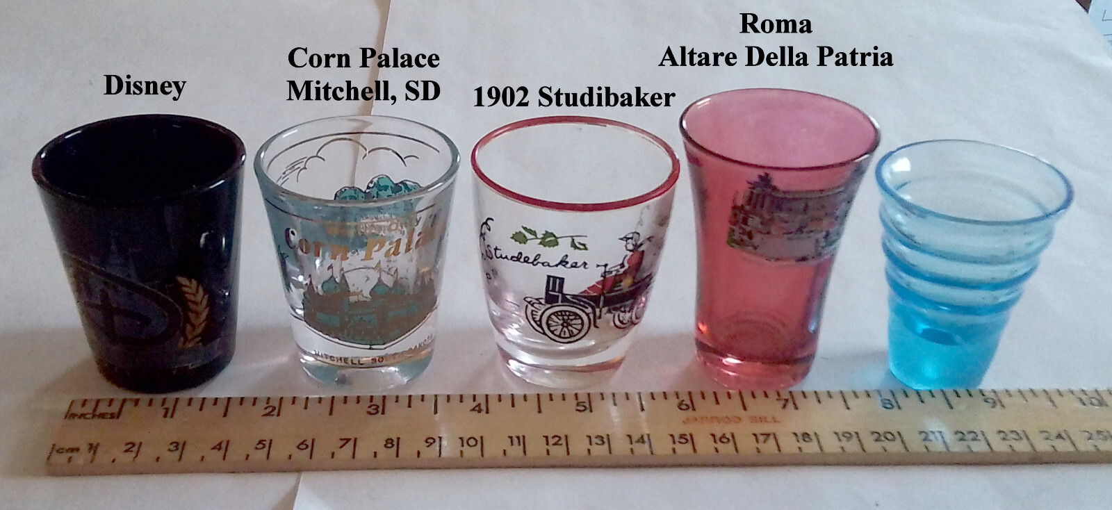 4 Themed Shot Glasses & 1 Plain.