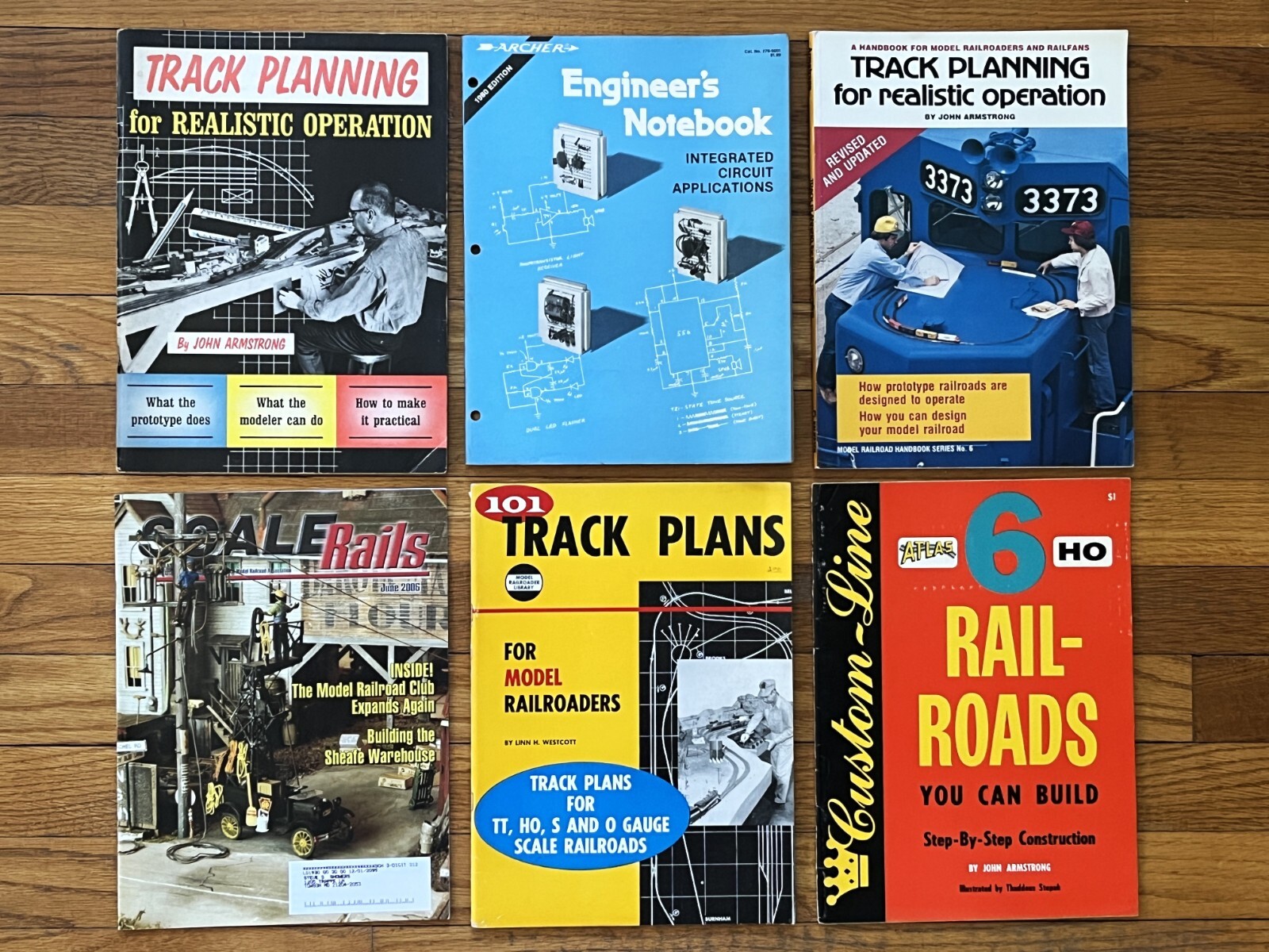 MODEL TRAINS -TRACK PLANNING (LOT OF 4) + ENGINEER’S CIRCUITRY BOOKLET + MORE