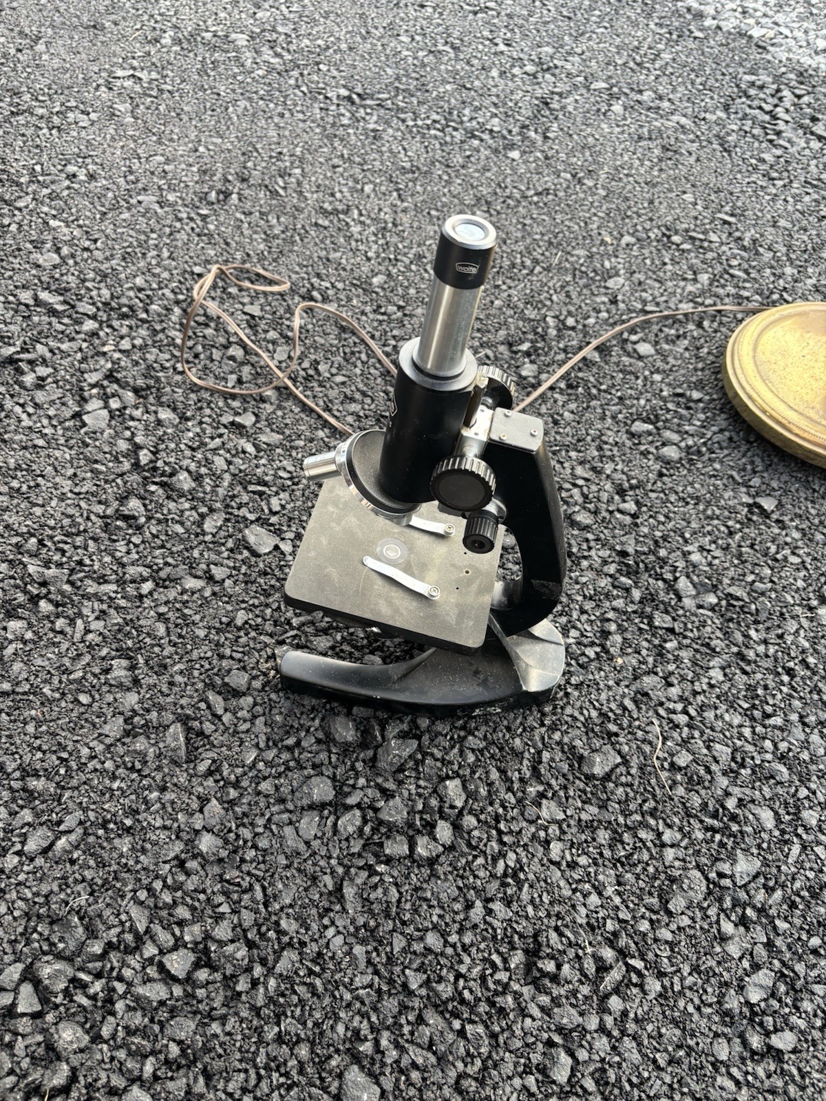 This is a vintage Wolfe student microscope likely imported from Japan,