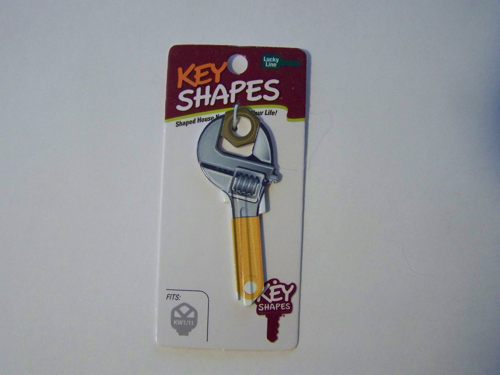 Wrench Kwikset house key blank.