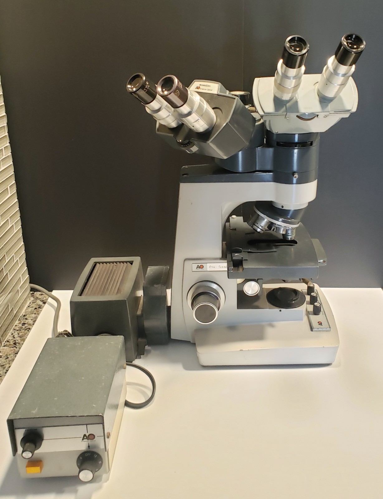 American Optical One-Twenty trinocular dual head Microscope 100-watt illuminator