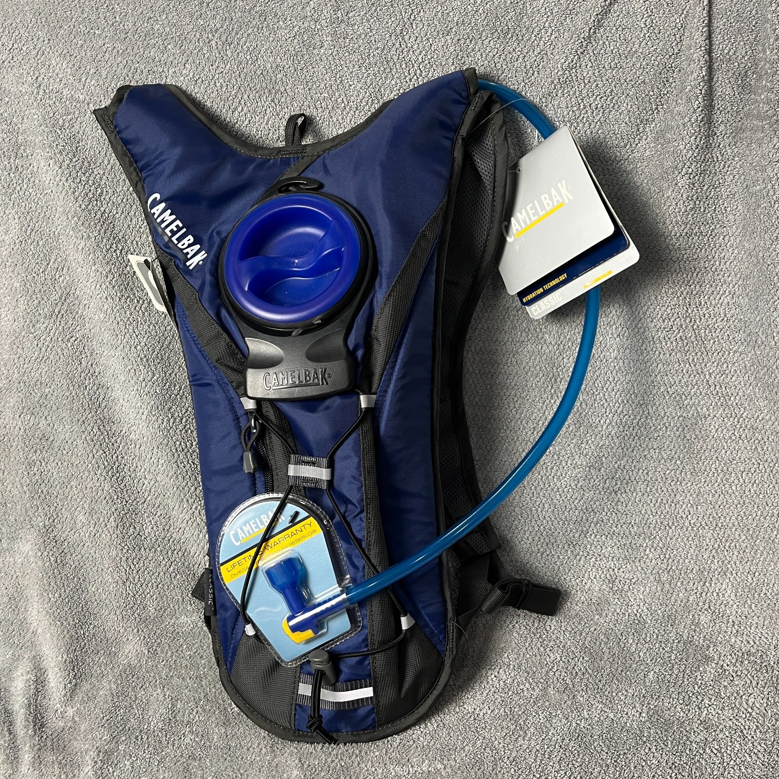 new with tags camelbak classic light hydration pack 70 oz blue and black