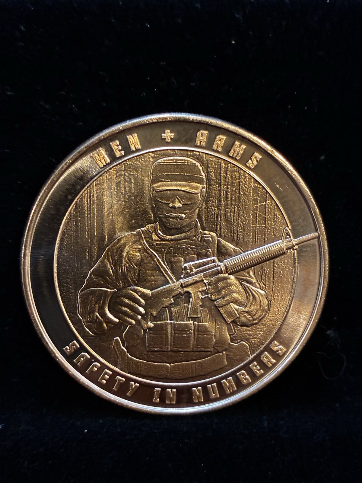 Men & Arms - Safety In Numbers - 1 Oz  AVDP .999 Fine Copper Round BU