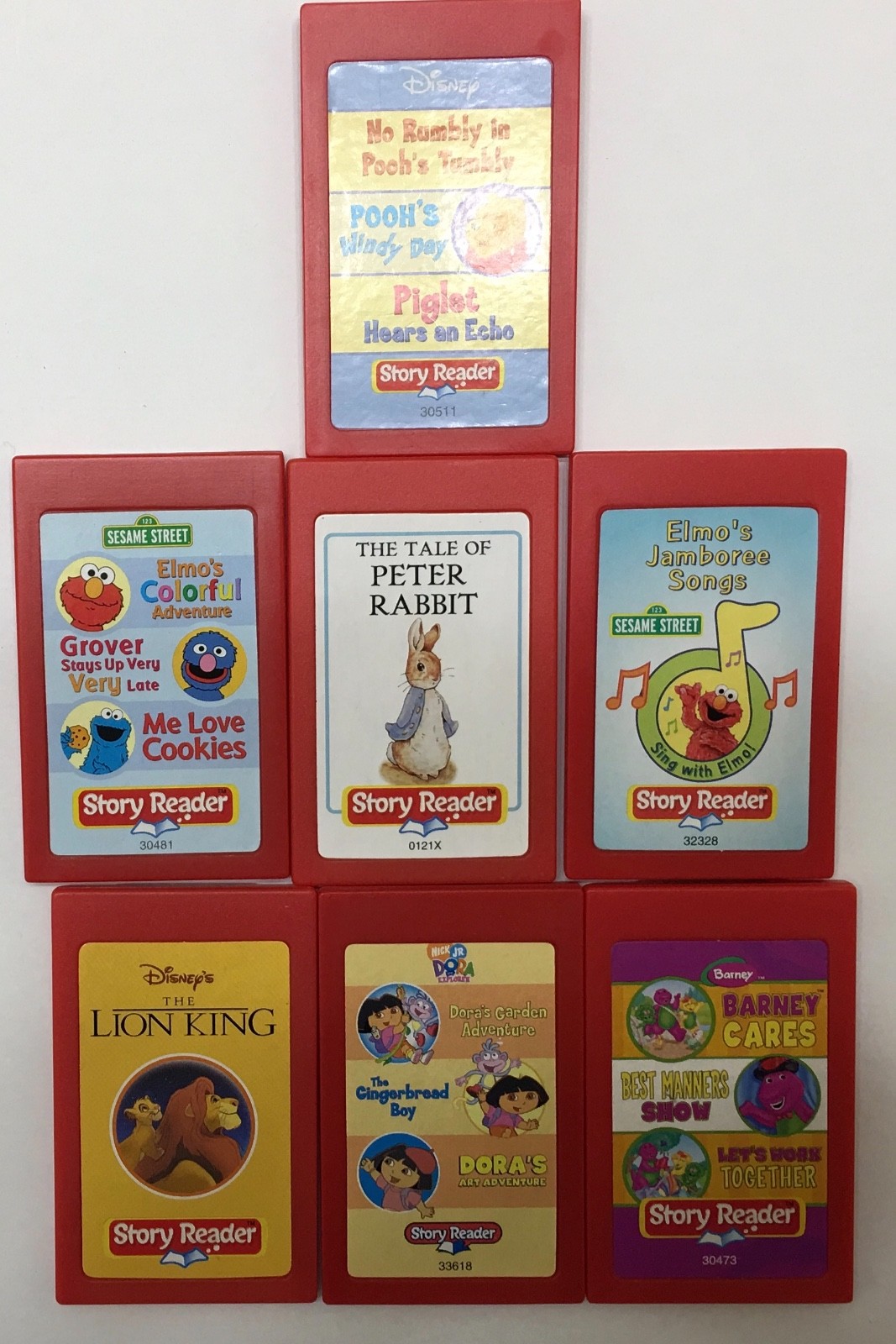 Story Reader Cassette Cartridge Lot of 7 Dora Elmo Pooh Lion Peter Rabbit Barney