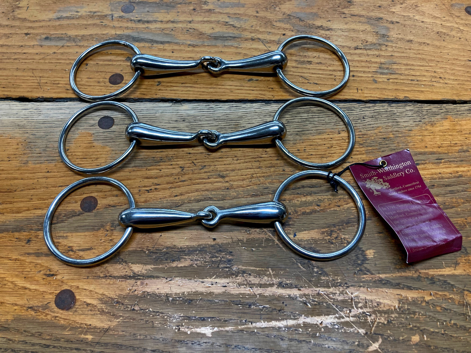 THREE SMITH WORTHINGTON LOOSE RING SNAFFLE BITS(4 3/4" - 5" - 5 1/4")