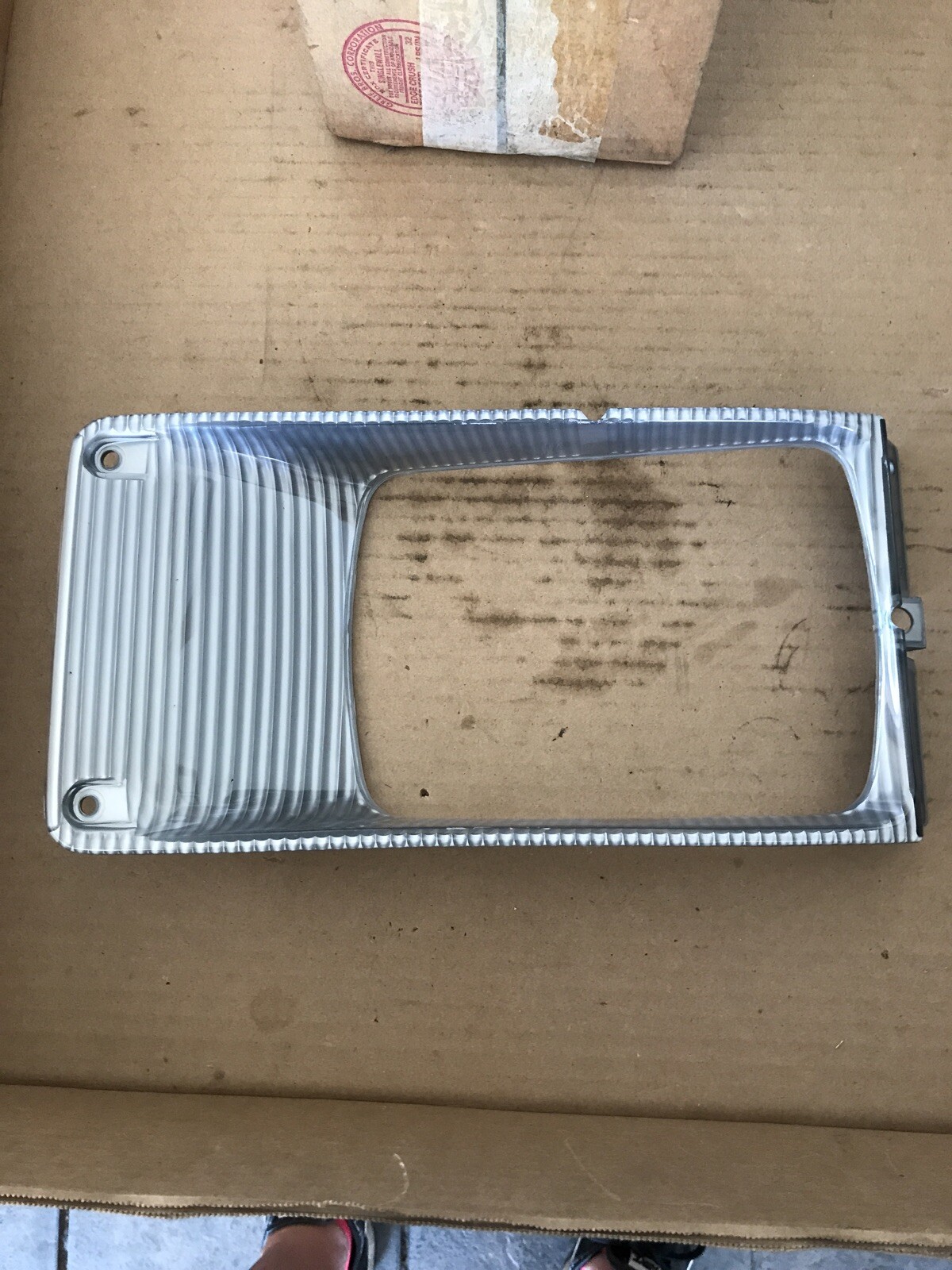 1661763C1 New OEM International Headlight Bezel, LH