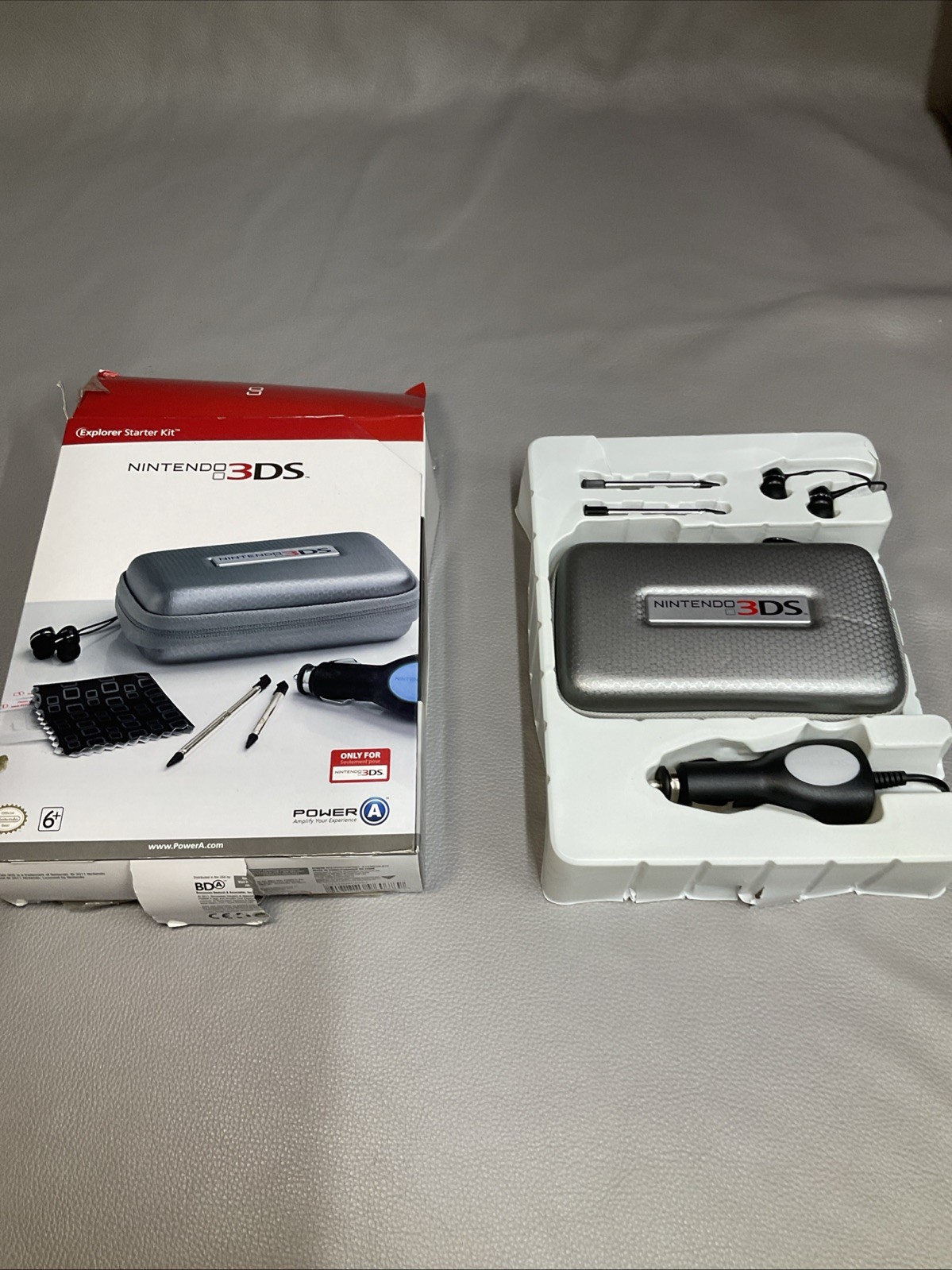 PowerA Nintendo 3DS Explorer Starter Kit Case, Ear Buds, Styluses, Car Adapter