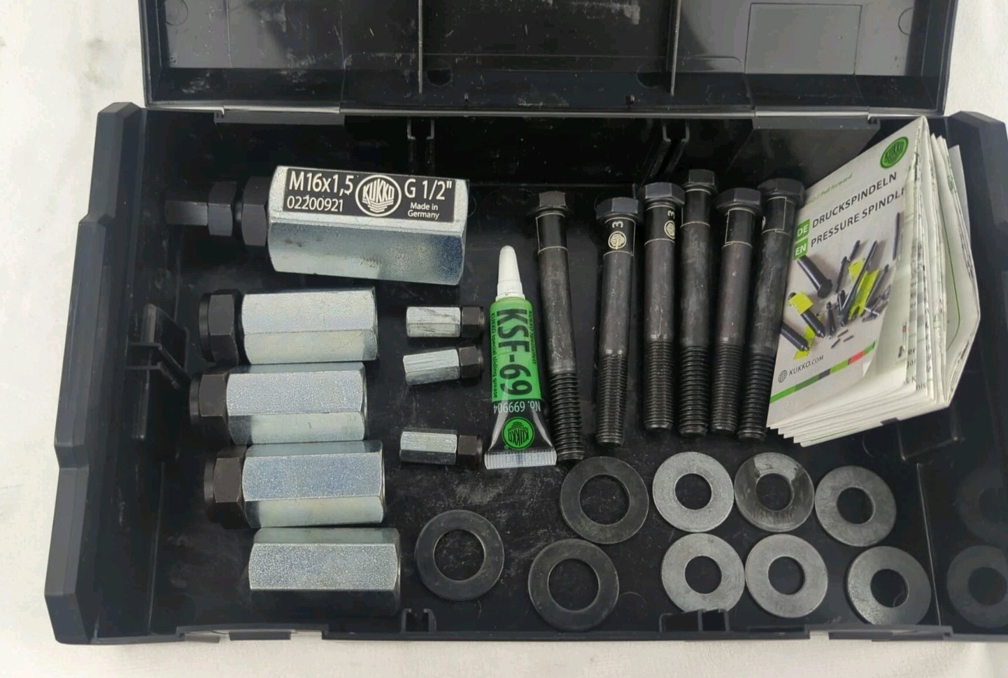Kukko L Boxx Mini with various connecting nuts adapters bolts washers