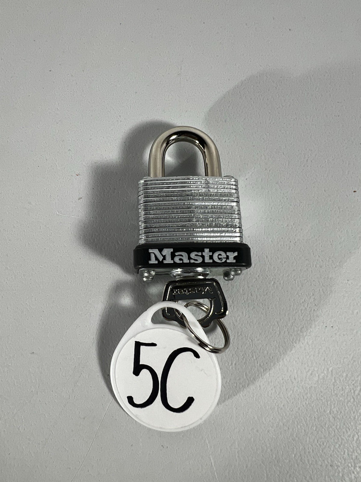 Master Lock Silver Laminated Steel Warded Padlock, Keyed 1-1/4-inch wide 1 Key