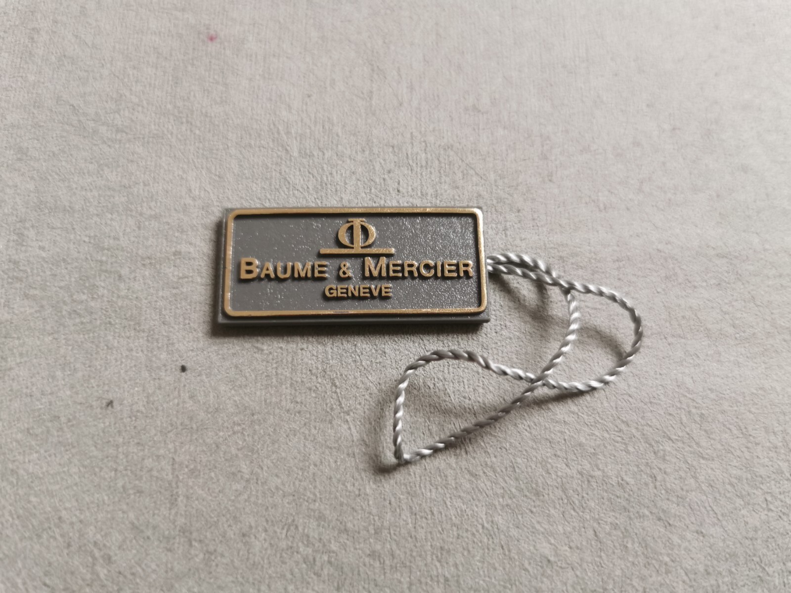 Baume & Mercier Vintage plastic rectangular grey tag very good