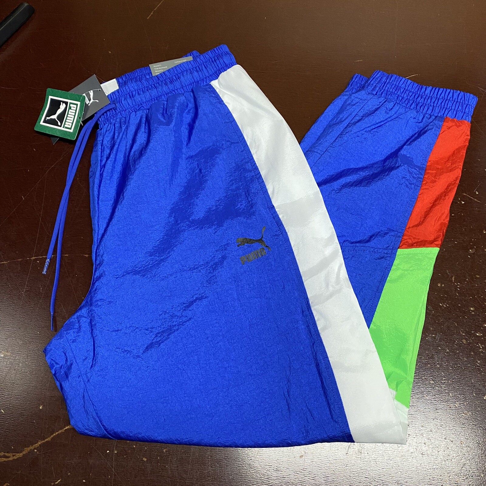 Puma TFS OG WINDBREAKER TRACK PANT DAZZLING BLUE/MULTICOLOR 596474-89 M-L-XL