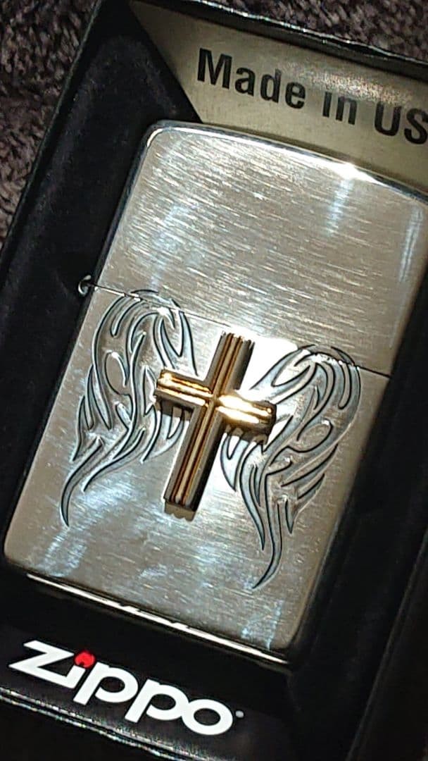 Zippo lighter with wing and cross design