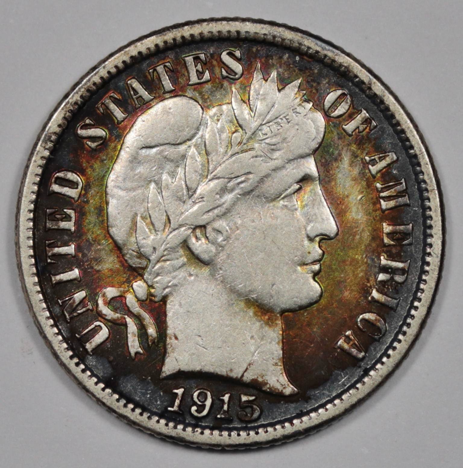 1915-s Barber Dime.  Pretty Album Toning.  AU.   209403