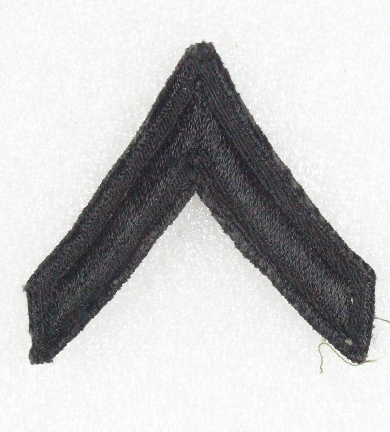 Army Chevron: Private First Class - Vietnam era, died black (early subdued)