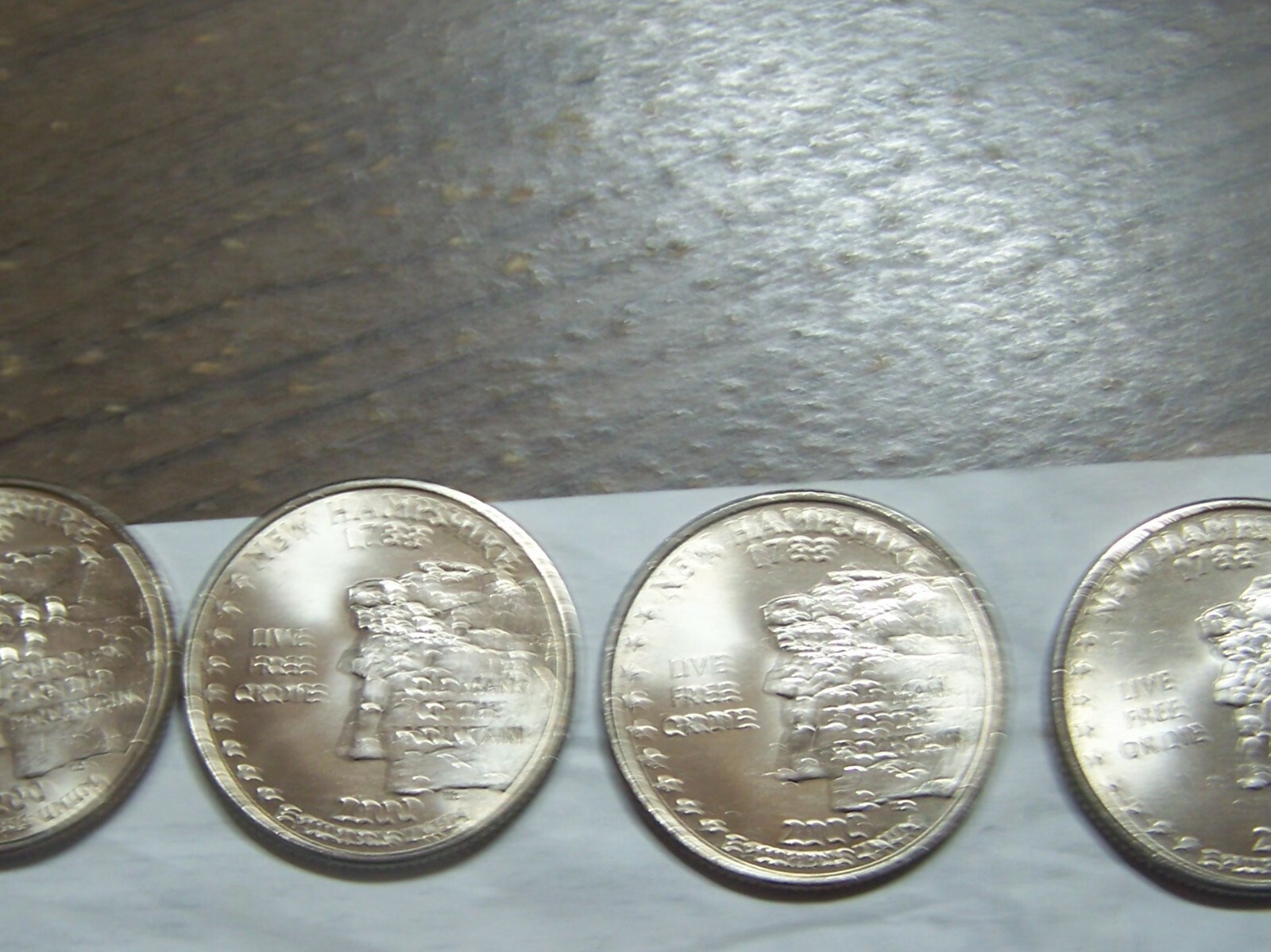 (4) COINS TTL NH STATE QUARTERS DETERIORATION DOUBLING