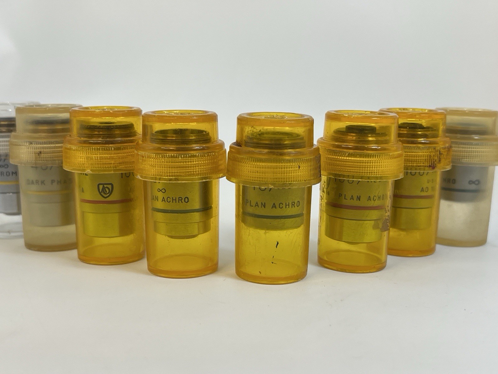 Lot of 8 AO American Optical Microscope Objectives Plan Achro Dark Phase Oil