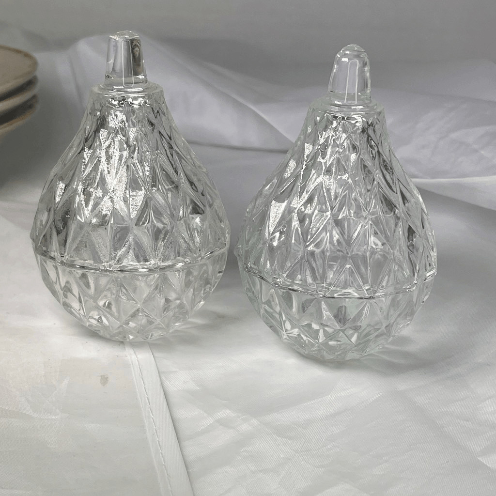 Lot of two lead crystal Romania pear shaped trinket boxes.