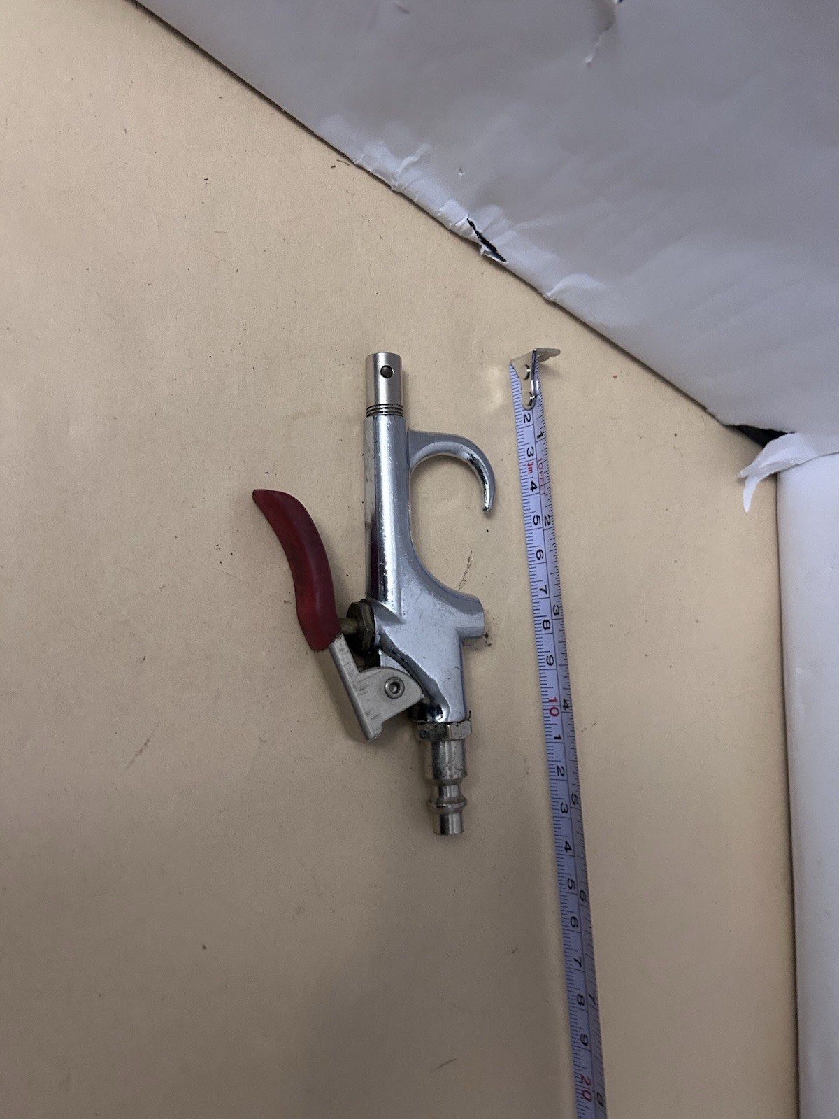 Unbranded untested pneumatic air gun with red handle