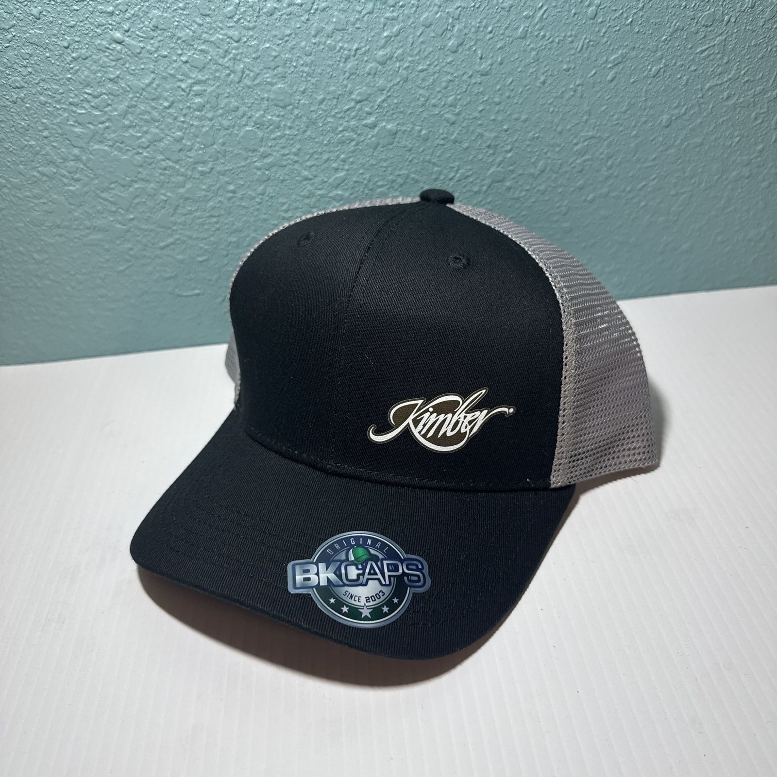 Kimber America Logo Black Trucker Hat with light gray Mesh