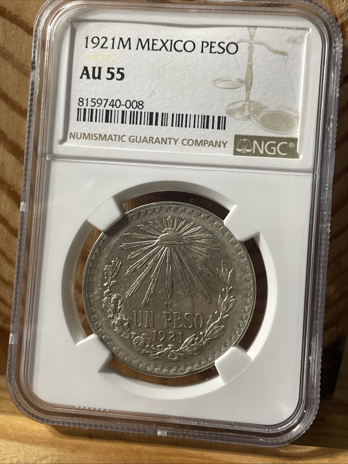 1921 Mexico Un Peso NGC AU55