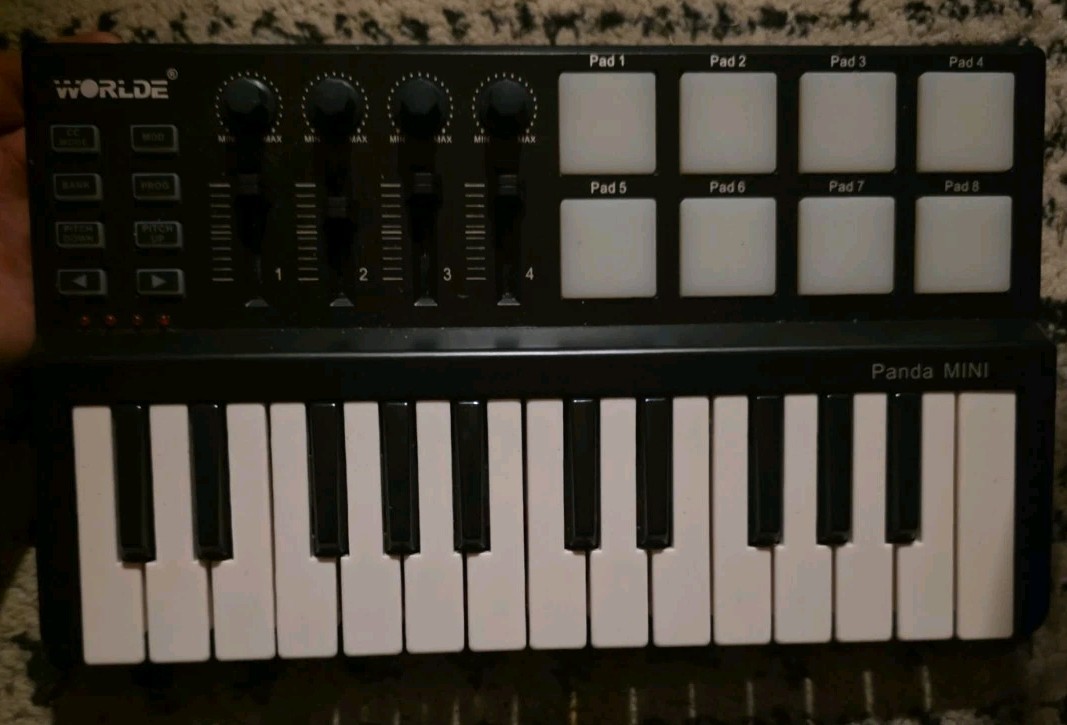 Worlde Panda Mini 25-Key USB Keyboard and Drum Pad MIDI Controller