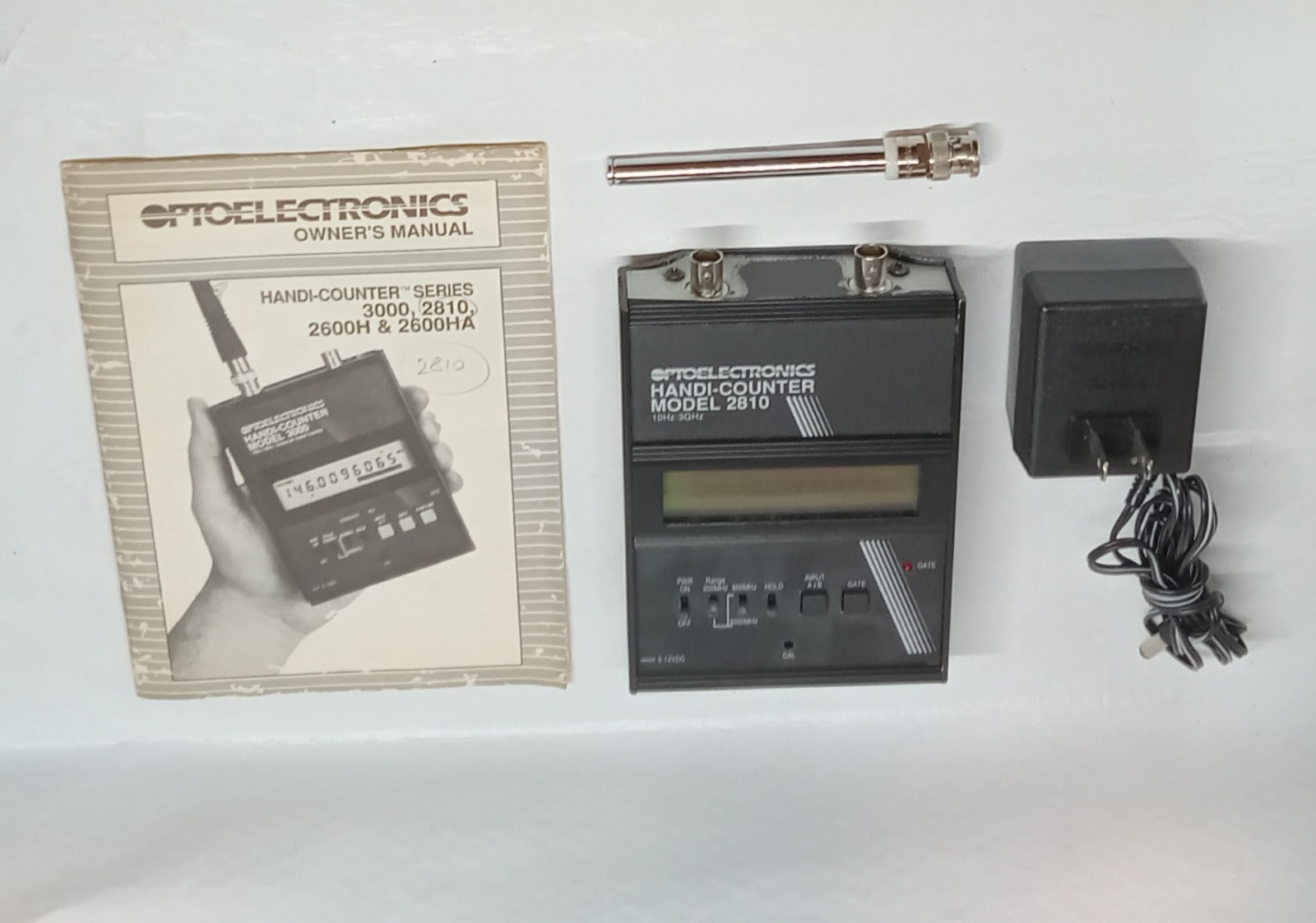 Optoelectronics Handi-Counter Model 2810 Portable Frequency Counter with Manual