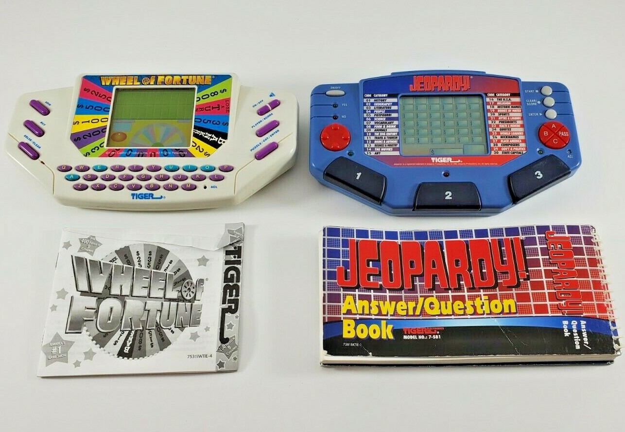 Lot of 2 Electronic Handheld Games Jeopardy & Wheel of Fortune Instruction WORKS
