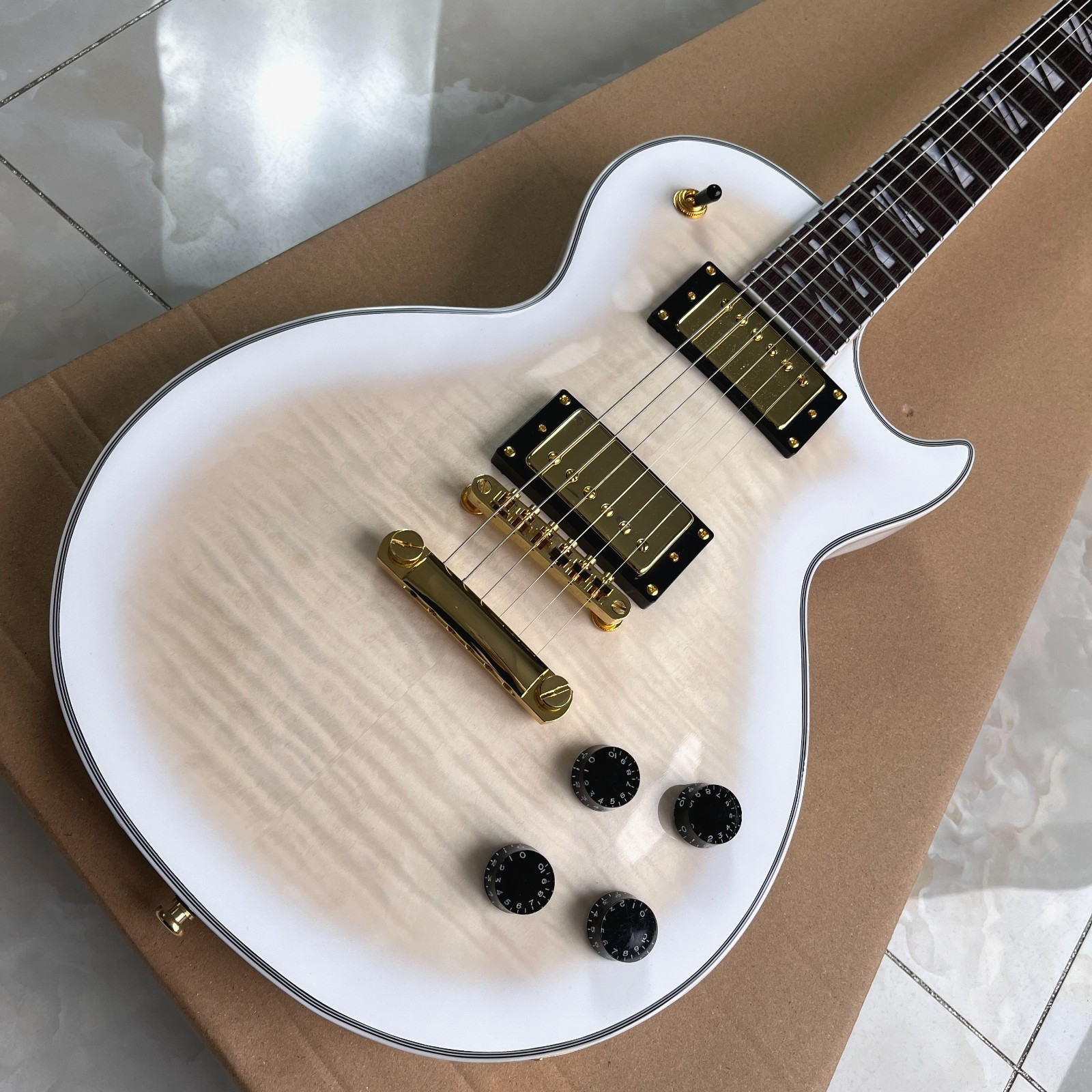 High quality LP electric guitar, mahogany solid body with maple top,