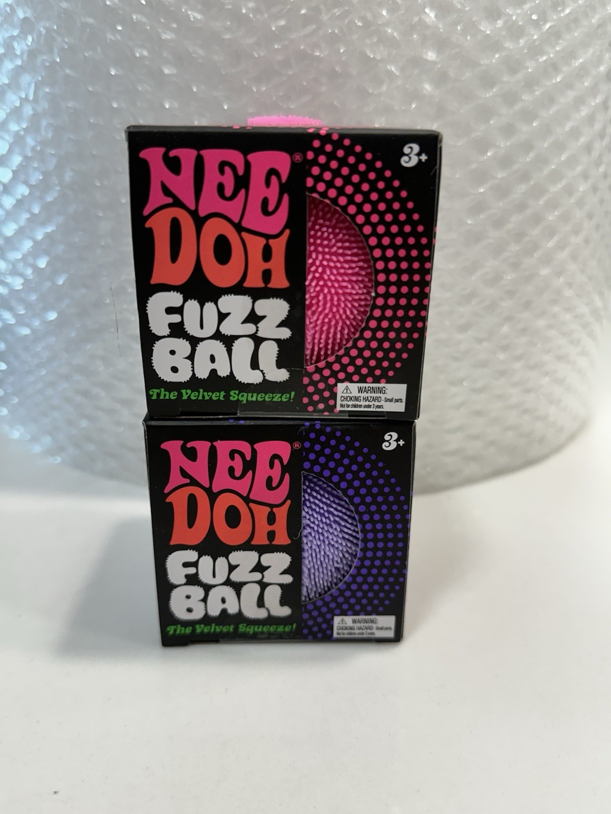 (2) NeeDoh Fuzz Ball’s - pink & Purple