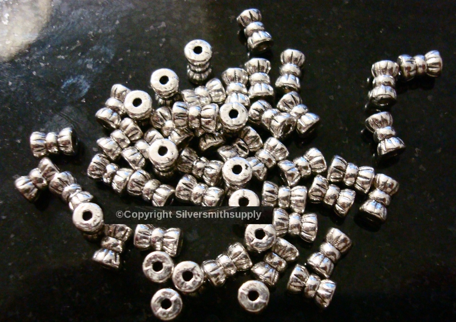 50 Antique silver plated bow shaped jewelry beading spacer filler beads FPB192