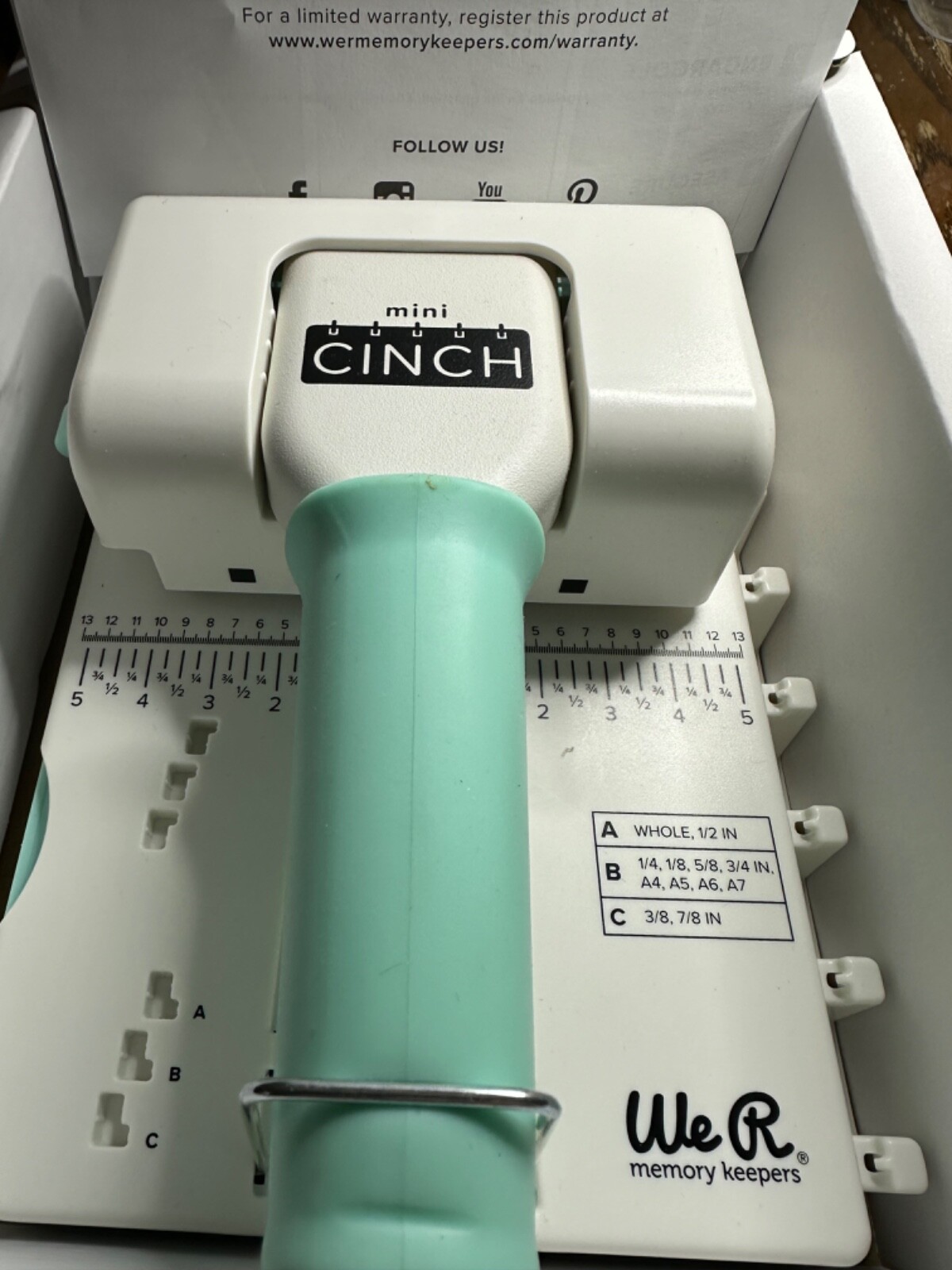 We R Memory Keepers Mini Cinch Book Binding Tool , turquoise color, used maybe 2