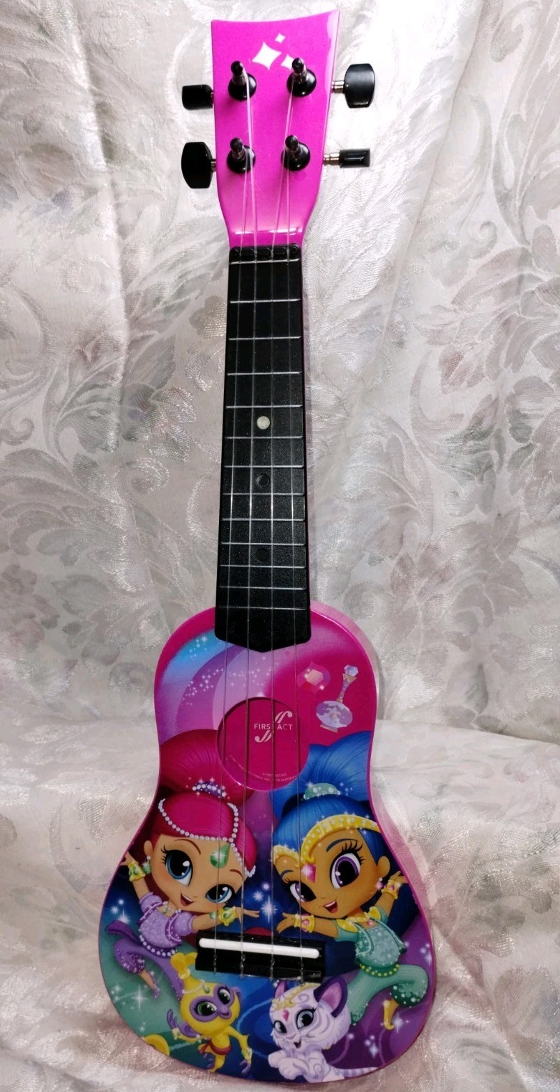 First Act Discovery Shimmer and Shine soprano toy ukulele.