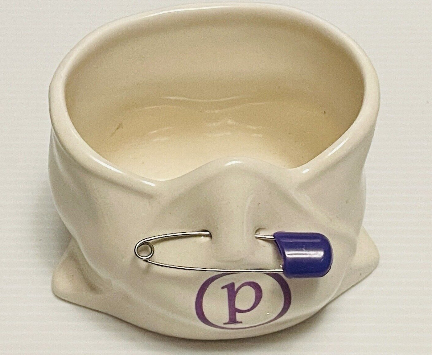 Babychix ceramic diaper shaped vase? with safety pin & the letter P on it.